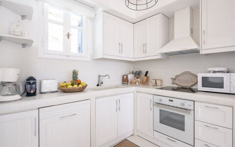 Villa Tiche: Kitchen, Cabinetry, Countertop, Kitchen Appliance, Major Appliance, Furniture, Interior Design, Sink, Cupboard, Home