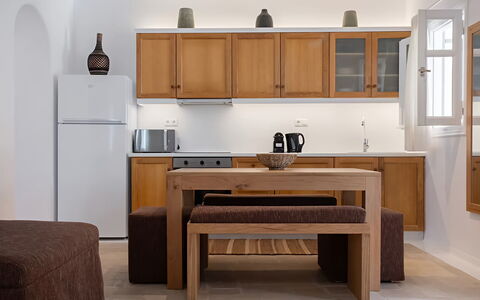 Mykonos Pool House 5: Furniture, Wood, Cabinetry, Interior Design, Flooring, Countertop, Kitchen, Table, Floor, Room