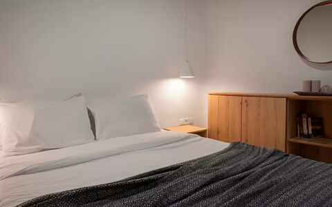 Mikonos Pool House 6: Bedroom, Interior Design, Bed, Wall, Bed Sheet, Furniture, Bedding, Wood, Linens, Floor