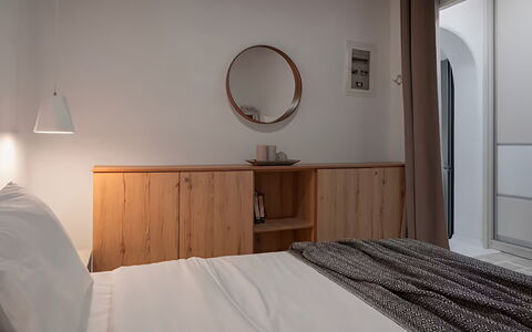 Mikonos Pool House 6: Furniture, Bed, Interior Design, Bedroom, Wall, Wood, Bed Sheet, Bedding, Flooring, Light Fixture