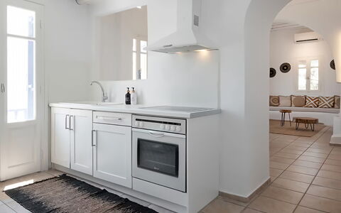 Mykonos Pool House 9: Flooring, Interior Design, Furniture, Floor, Kitchen, Countertop, Cabinetry, Major Appliance, Ceiling, Kitchen Appliance