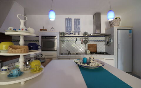 Villa Patrizia Otranto: Deluxe Countryside Retreat: Furniture, Interior Design, Kitchen, Lighting, Flooring, Table, Room, Countertop, Chair, Ceiling