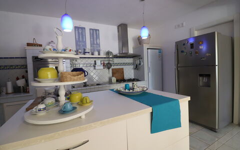 Villa Patrizia Otranto: Deluxe Countryside Retreat: Kitchen Appliance, Furniture, Kitchen, Major Appliance, Interior Design, Countertop, Home Appliance, Cabinetry, Room, Lighting