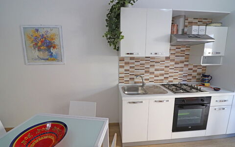 Luisa: Kitchen Appliance, Kitchen, Major Appliance, Furniture, Wood, Interior Design, Flooring, Countertop, Cabinetry, Kitchen Stove