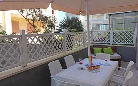 Luisa: Furniture, Outdoor Furniture, Floor, Chair, Flooring, Table, Interior Design, Outdoor Table, Shade, Balcony