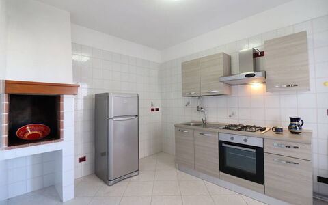 Ludovica: Flooring, Kitchen, Interior Design, Major Appliance, Wood, Floor, Kitchen Appliance, Cabinetry, Countertop, Room
