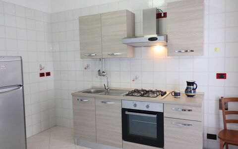 Ludovica: Kitchen, Kitchen Appliance, Major Appliance, Countertop, Kitchen Stove, Flooring, Wood, Kitchen Sink, Stove, Cabinetry