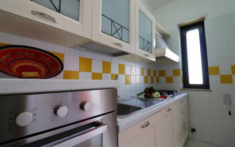 Gio: Kitchen, Kitchen Stove, Major Appliance, Kitchen Appliance, Flooring, Countertop, Interior Design, Yellow, Gas Stove, Stove