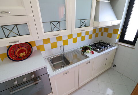 Gio: Kitchen, Kitchen Stove, Major Appliance, Kitchen Appliance, Countertop, Stove, Wood, Flooring, Gas Stove, Interior Design