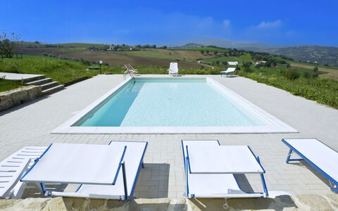 Il Casolare e Il Fienile: Swimming Pool, Outdoor Furniture, Furniture, Composite Material, Shade, Resort, Chair, Concrete, Tile, Sunlounger