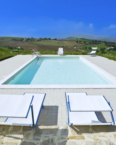 Il Casolare e Il Fienile: Swimming Pool, Outdoor Furniture, Furniture, Composite Material, Shade, Resort, Chair, Concrete, Tile, Sunlounger