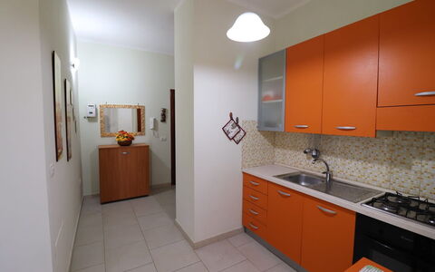 Lucia: Kitchen, Countertop, Flooring, Wood, Kitchen Appliance, Major Appliance, Interior Design, Cabinetry, Floor, Furniture