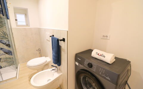 Penelope'S House Centro Storico: Flooring, Floor, Washing Machine, Interior Design, Plumbing Fixture, Bathroom, Plumbing, Room, Clothes Dryer, Lighting