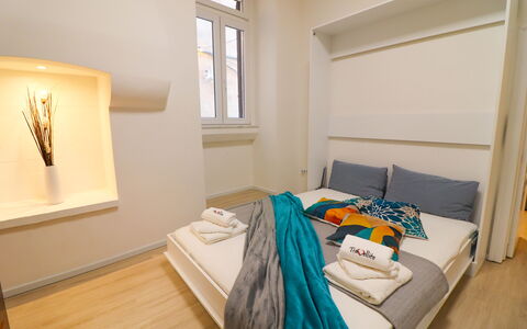 Penelope'S House Centro Storico: Interior Design, Furniture, Flooring, Floor, Wood, Bedroom, Room, Lighting, Ceiling, Bed
