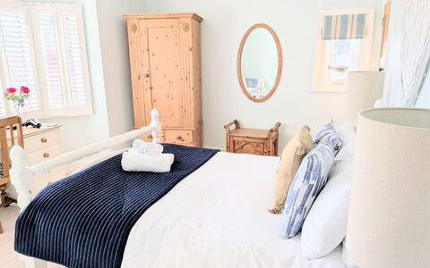 Tenby Cottage: Furniture, Bed, Bedding, Bedroom, Bed Sheet, Interior Design, Linens, Wood, Room, Textile