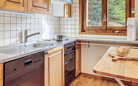 Chalet Chemin du Four: Kitchen, Wood, Countertop, Kitchen Appliance, Major Appliance, Flooring, Interior Design, Kitchen Sink, Cabinetry, Sink