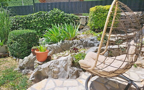 Dripić: Flowerpot, Rock, Furniture, Garden, Outdoor Furniture, Shrub, Flagstone, Backyard, Chair