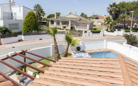 Estrella Ii: Home, Door, Cottage, Yard, Chair, Outdoor Furniture, Backyard, Outdoor Table, Houseplant, Awning