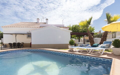 Estrella Ii: Home, Door, Cottage, Yard, Chair, Outdoor Furniture, Backyard, Outdoor Table, Houseplant, Awning