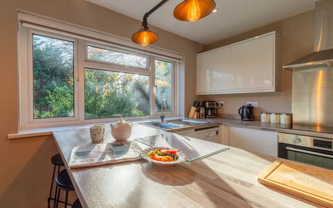 The Bungalow: Home, Door, Cottage, Yard, Chair, Outdoor Furniture, Backyard, Outdoor Table, Houseplant, Awning