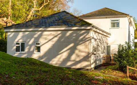 The Bungalow: Home, Door, Cottage, Yard, Chair, Outdoor Furniture, Backyard, Outdoor Table, Houseplant, Awning