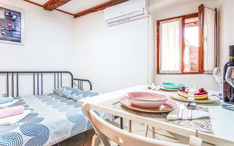Piccolo Mondo: Wall, Bedroom, Bed, Bed Sheet, Furniture, Bedding, Home, Apartment, Floor, Interior Design