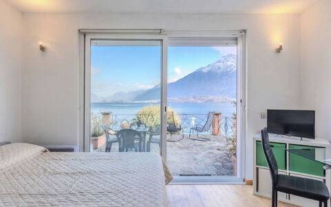 La Terrazza sul Lago: Home, Door, Cottage, Yard, Chair, Outdoor Furniture, Backyard, Outdoor Table, Houseplant, Awning