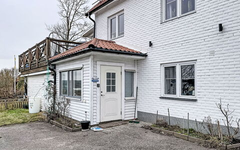 Stadsro: Home, Door, Cottage, Yard, Chair, Outdoor Furniture, Backyard, Outdoor Table, Houseplant, Awning