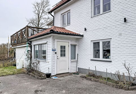 Stadsro: Home, Door, Cottage, Yard, Chair, Outdoor Furniture, Backyard, Outdoor Table, Houseplant, Awning