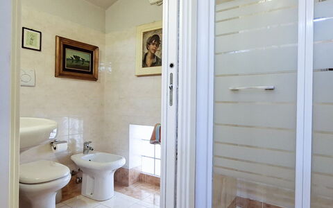 Isola: Flooring, Floor, Plumbing Fixture, Interior Design, Door, Bathroom, Room, Plumbing, Toilet, Tile