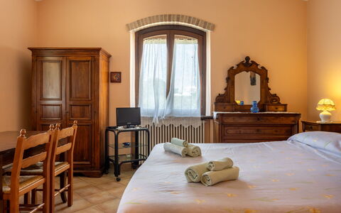 Il Giuncheto, Pool, Amazing View, Umbrian Countrys: Wall, Furniture, Interior Design, Room, Flooring, Lighting, Floor, Ceiling, Bedroom, Door
