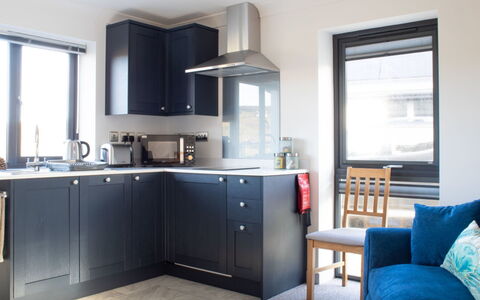 The Studio: Furniture, Kitchen, Kitchen Appliance, Countertop, Interior Design, Cabinetry, Major Appliance, Flooring, Light Fixture, Home Appliance