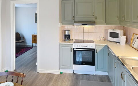 Villa Gärdet: Furniture, Interior Design, Flooring, Cabinetry, Wood, Kitchen, Kitchen Appliance, Countertop, Floor, Major Appliance