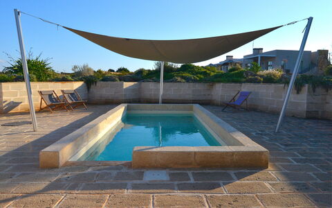 Villa Carovi: Swimming Pool, Composite Material, Shade, Flagstone, Concrete, Outdoor Furniture, Tile, Landscaping, Backyard, Courtyard