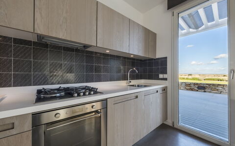 Villa Carovi: Kitchen, Countertop, Flooring, Major Appliance, Cabinetry, Kitchen Appliance, Ceiling, Tile, Kitchen Stove