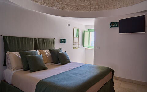 Trullo Emmebi Vista Valle D'Itria: Furniture, Interior Design, Flooring, Ceiling, Room, Bed, Bedroom, Light Fixture, Lamp, Pillow