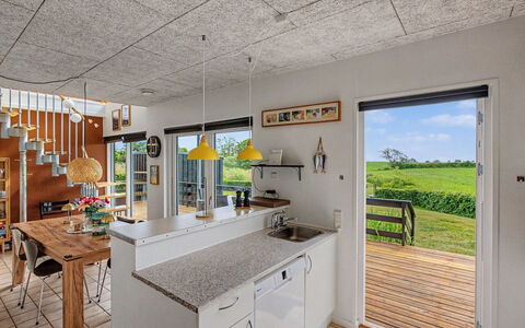 Angret - 380M from the Sea: Ceiling, Hardwood, Kitchen, Wood Stain, Design, Chair, Plywood, Countertop, Houseplant, Kitchen & Dining Room Table