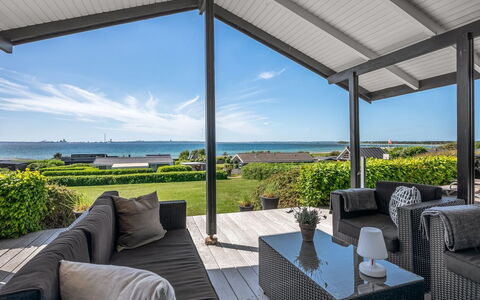 Gertina - 100M from the Sea: Home, Roof, House, Door, Cottage, Shade, Garden, Groundcover, Porch, Yard
