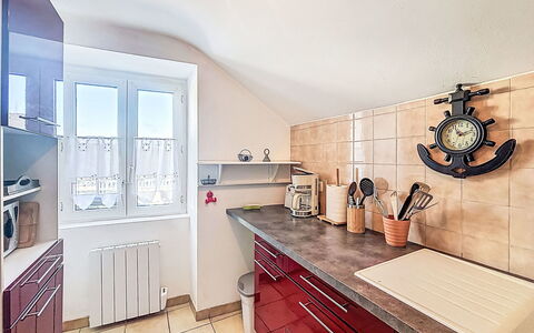 Maison Aristide Briand: Kitchen, Countertop, Flooring, Interior Design, Kitchen Appliance, Cabinetry, Major Appliance, Floor, Furniture, Home