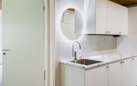 Villa Lumo: Flooring, Interior Design, Wood, Countertop, Kitchen, Floor, Ceiling, Lighting, Plumbing Fixture, Cabinetry