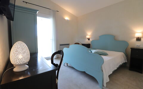Elegante Villa Casale 50: Furniture, Interior Design, Bedroom, Floor, Bed, Flooring, Bed Sheet, Room, Textile, Lighting