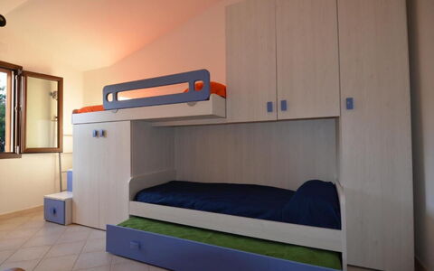 Appartamento Tamara, Budoni: Furniture, Wood, Interior Design, Flooring, Bedroom, Floor, Room, Bed, Ceiling, Drawer