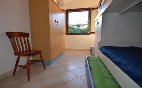 Appartamento Tamara, Budoni: Wood, Furniture, Interior Design, Floor, Bedroom, Flooring, Bed, Room, Apartment, Home