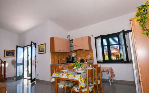 Appartamento Agrustos, Wifi, Ac: Furniture, Chair, Kitchen & Dining Room Table, Shade, Houseplant, Balcony, Coffee Table, Outdoor Table