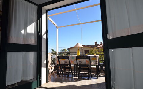 Appartamento Agrustos, Wifi, Ac: Glass, Metal, Iron, Shade, Chair, Balcony, Aluminium, Outdoor Structure, Outdoor Furniture, Eco Hotel