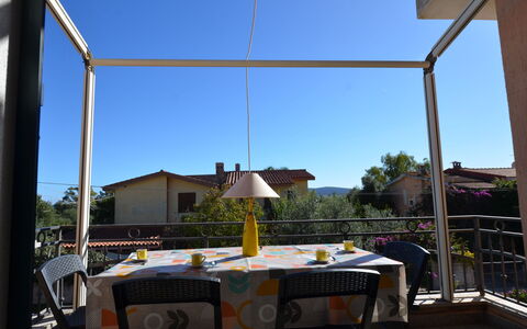 Appartamento Agrustos, Wifi, Ac: Furniture, Chair, Shade, Outdoor Furniture, Outdoor Structure, Glass, Outdoor Table, Balcony, Houseplant, Porch
