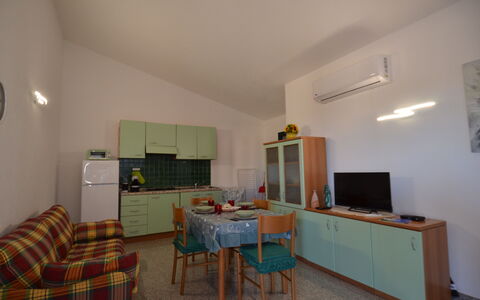Appartamento Nina, Ac, Wifi: Flooring, Furniture, Interior Design, Floor, Ceiling, Room, Chair, Apartment, Wood Stain, Kitchen & Dining Room Table