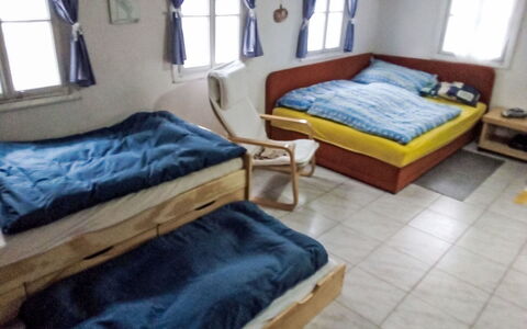 Roubenka U Potoka: Wood, Furniture, Flooring, Floor, Bed, Bedroom, Room, Bed Frame, Bedding, Cushion