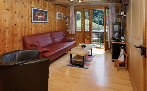 Haus Margrittli: Furniture, Wood, Flooring, Interior Design, Floor, Room, Couch, Wood Flooring, Ceiling, Living Room