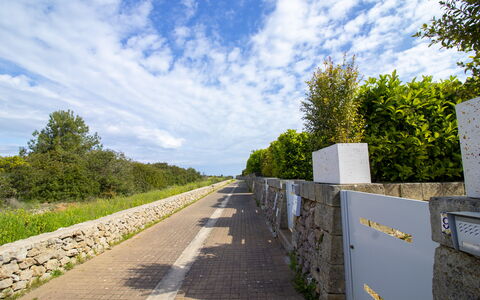 Villa i Gabbiani Otranto: Sky, Blue, Daytime, Thoroughfare, Walkway, Sunlight, Sidewalk, Stone Wall, Trail, Path